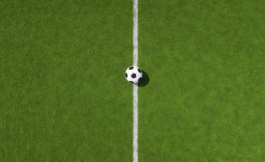 Yeşil sahada beyaz orta çizgide futbol.