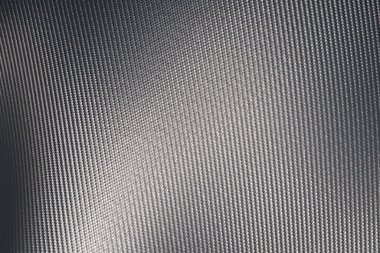 Gri karbon fiber doku yüzeyini kapatın. Doku ve şablon arka planı. Modern teknoloji ve malzeme konsepti.