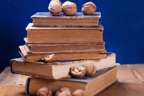 Walnuts on old book — Stock Photo, Image