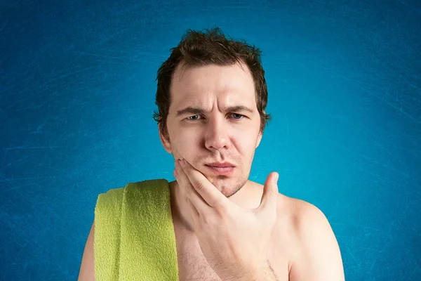 Man with a towel on shoulder