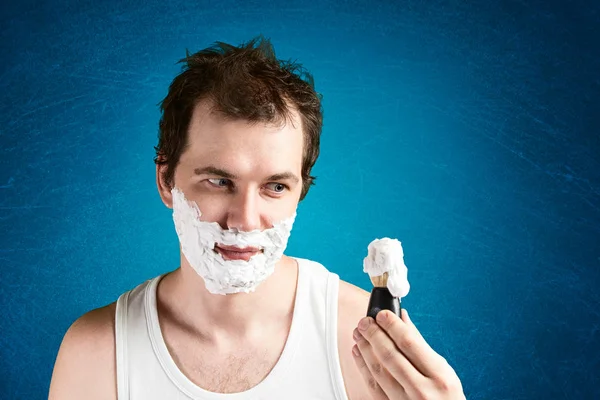 Man with foam on the face — Stock Photo, Image