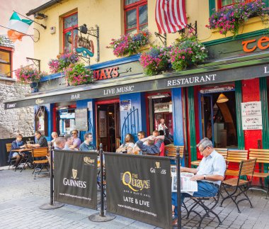 GALWAY, IRELAND - AUGUST 18, 2012: Located in the city centre of Galway's vibrant Latin Quarter, The Quays, Galway, is one of Galway's most famous and historic drinking establishments.