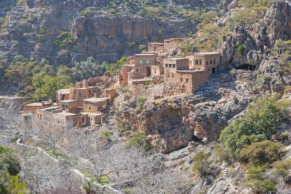 The ghost town of Wadi Habib in the Jebel Akhdar Mountains of the Sultanate of Oman. A traditional working falaj (irrigation canal) can be seen in the left foreground.