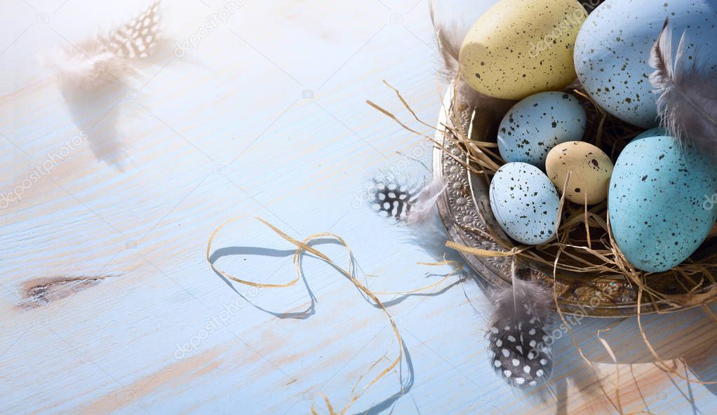 art Happy Easter day; Holidays background with Easter eggs on bl