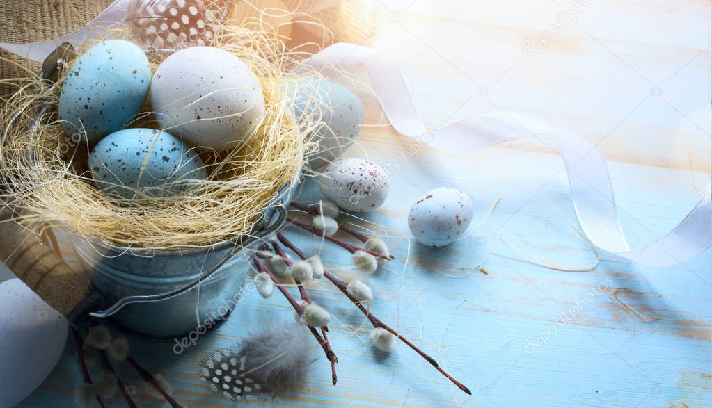 Happy Easter;  Easter eggs on blue table background 