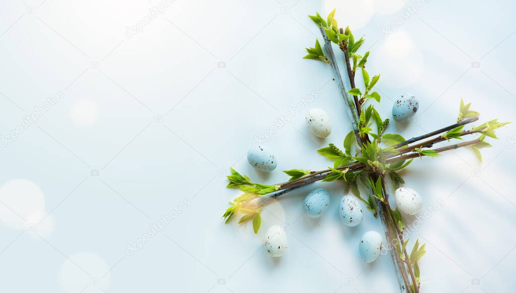 Easter flower cross and Easter eggs on white background; Christian awakening life symbo