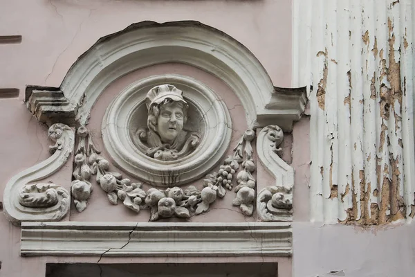 Relief on facade of old building, mascaron ornament