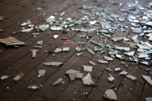 Pieces of shattered glass or mirror