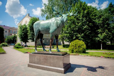 Gusev, Russia - June 19, 2019: The bronze statue of an elk made in Berlin 1911 by Ludwig Fordemayer, now located in Gusev, Kaliningrad region.