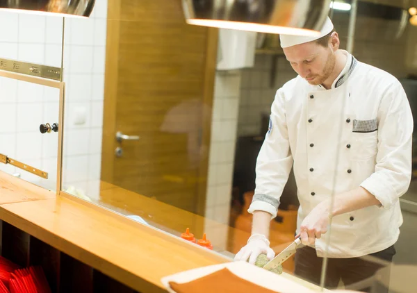 Young chef in the restaurant — Stock Photo, Image