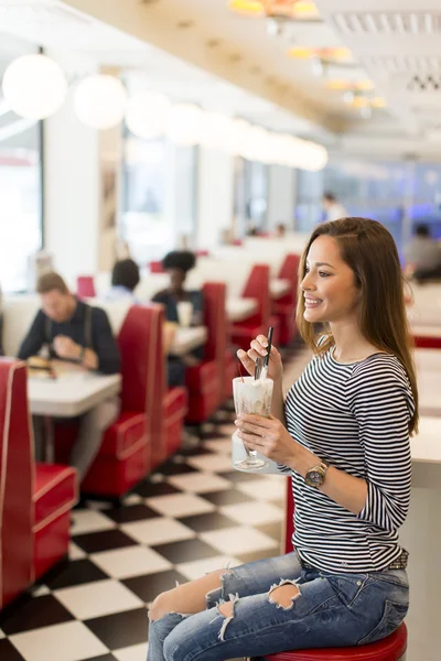 Young woman having diner — Stock Photo, Image