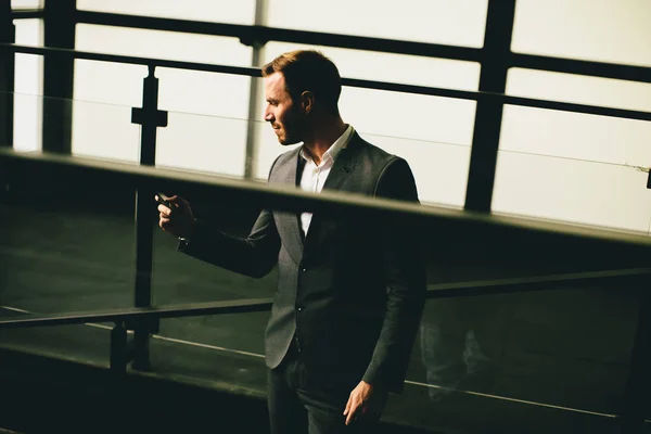 Young modern businessman with smartphone — Stock Photo, Image