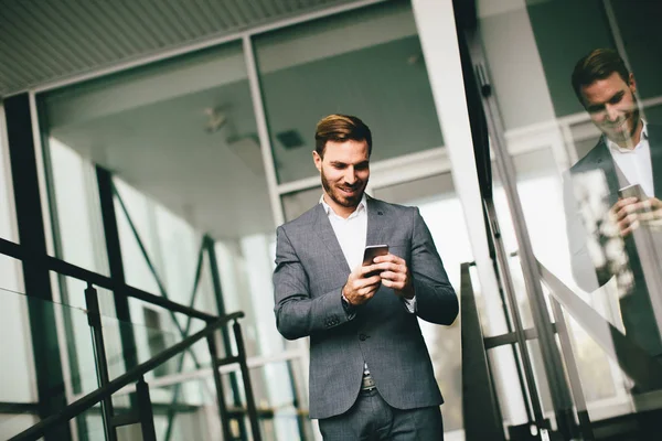 Young modern businessman with smartphone — Stock Photo, Image