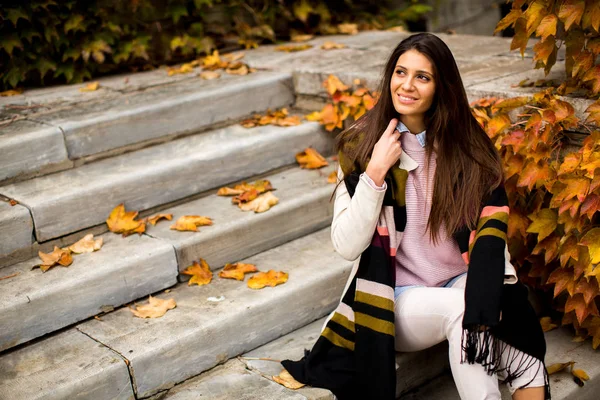 Young woman on stairs — Stock Photo, Image