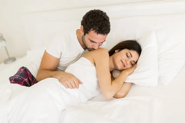 Young couple in the bed — Stock Photo, Image