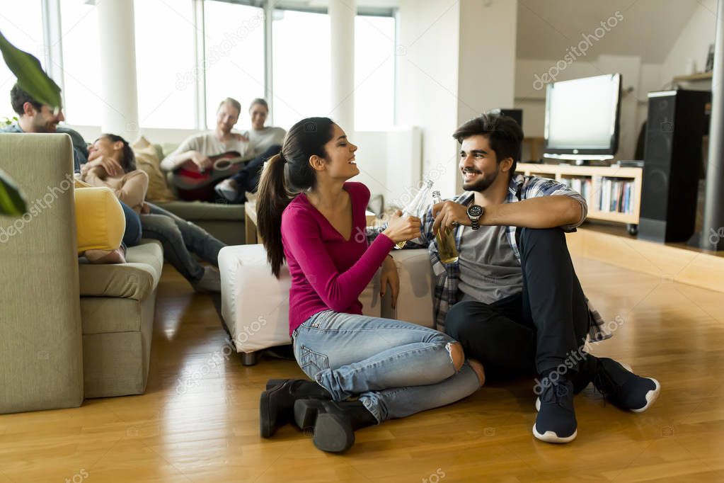 Young couple having fun at party