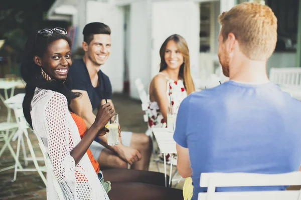 Multiracial friends at cafe — Stock Photo, Image