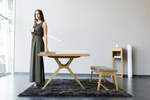 Pretty young woman in the room