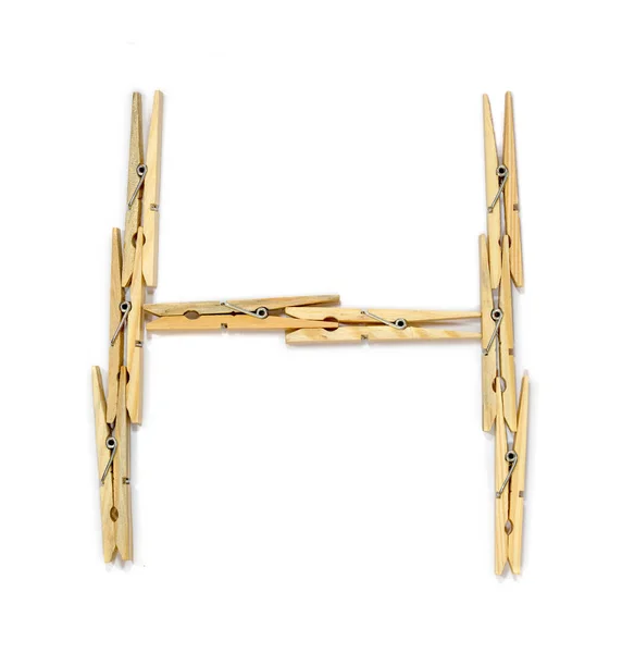 Clothespins form harf H — Stok fotoğraf