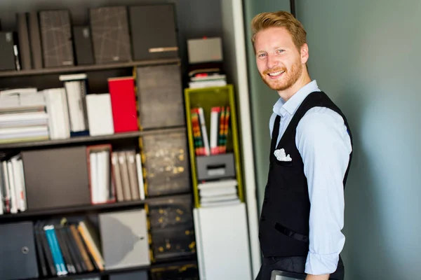 Businessman with a tablet in the office — Stock Photo, Image