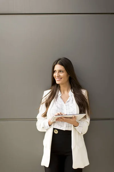 Businesswoman with tablet in office — Stock Photo, Image