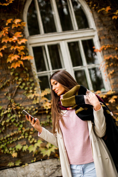 Woman with phone outdoor