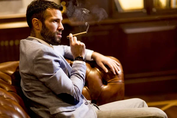 Handsome man smoking cigar — Stock Photo, Image