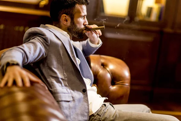 Handsome man smoking cigar — Stock Photo, Image