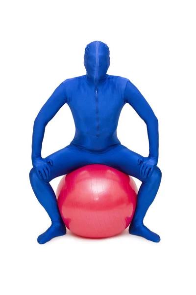 Man in morphsuit exercise with pilates ball — Stock Photo, Image