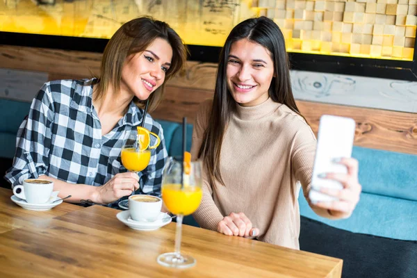 Women taking selfie in the cafe — Stock Photo, Image