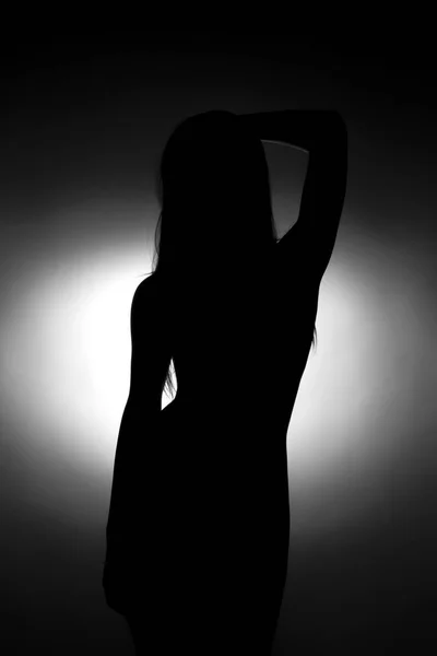 Silhouette of cute young girl — Stock Photo, Image