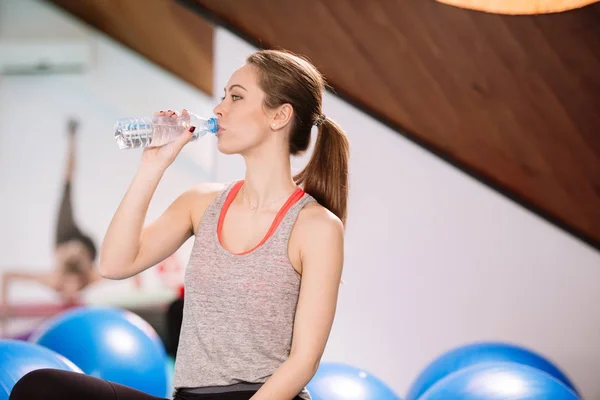 Young woman exercising in the gym Stock Photo