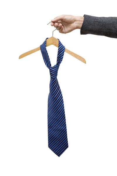 Man holds in his hand a tie on a hanger — Stock Photo, Image