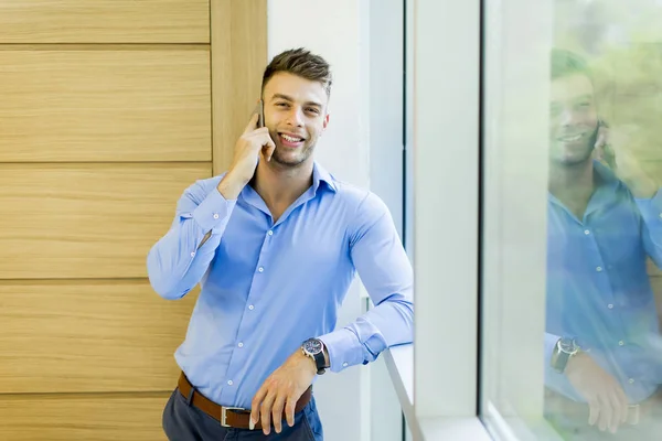 Handsome young man in office — Stock Photo, Image