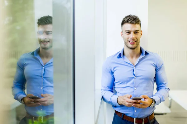 Handsome young man in office — Stock Photo, Image