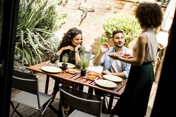 People have lunch in the courtyard