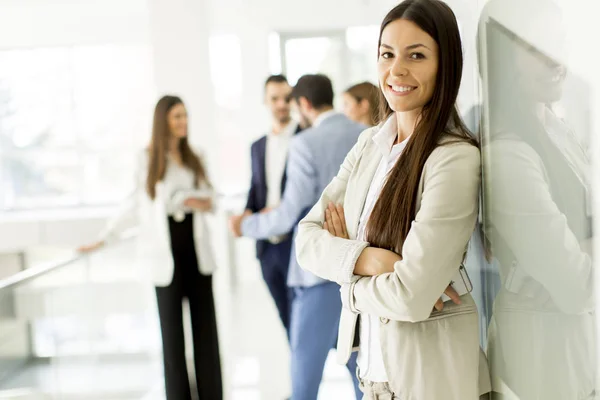 Businesswoman in the office background — Stock Photo, Image