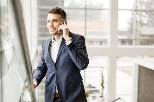 Businessman with smartphone in the office — Stock Photo, Image