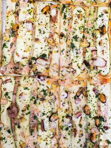 Zucchini and seafood pizza