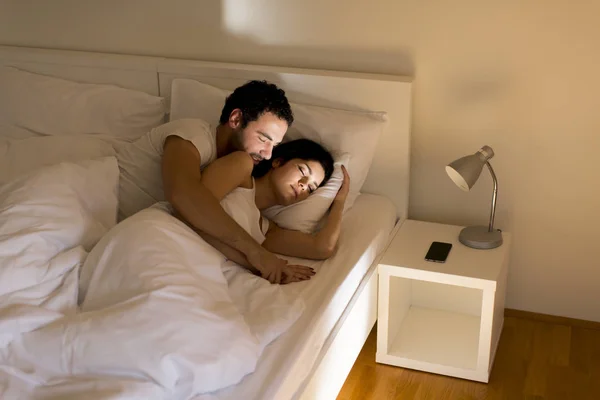 Loving couple on bed — Stock Photo, Image