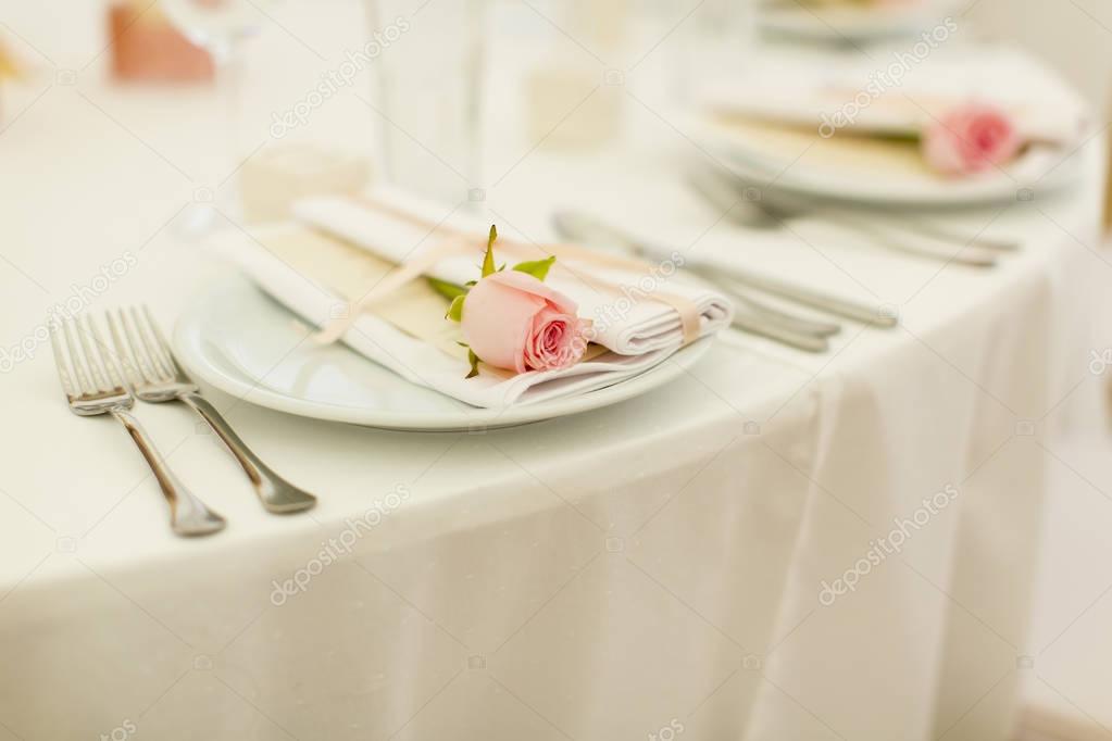 Elegant wedding decoration. Focus on pink rose