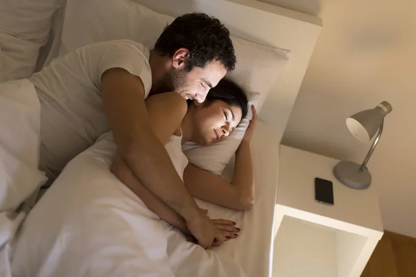 Loving couple on bed — Stock Photo, Image