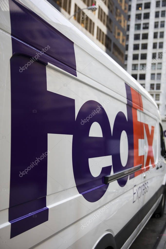 NEW YORK, USA - AUGUST 24, 2017: Detail from FedEx truck in New York, USA. FedEx Corporation is an American multinational courier delivery services company from Memphis, Tennessee, founded at 1971.