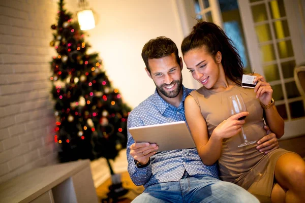 Young couple with tablet at New Years eve