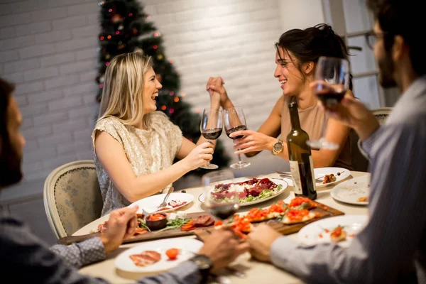 Friends celebrating Christmas or New Year eve — Stock Photo, Image