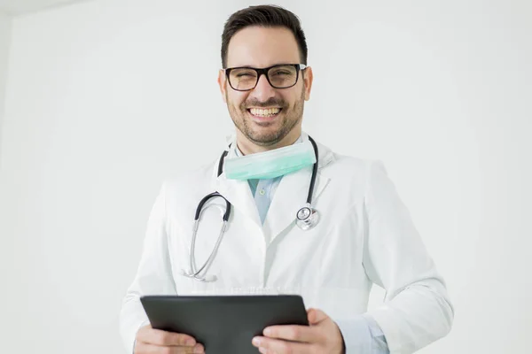 Doctor with tablet isolated on white — Stock Photo, Image
