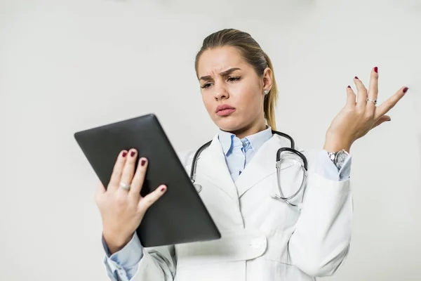Pretty young female doctor with digital tablet — Stock Photo, Image