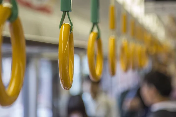 Hand holders in public transportation — Stock Photo, Image
