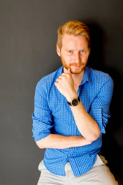 Portrait of ginger young man against wall — Stock Photo, Image