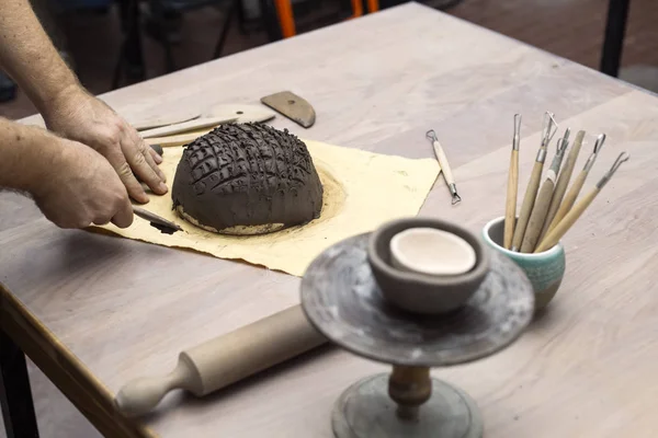 Skilled master preparing clay workpieces for new his creations — Stock Photo, Image